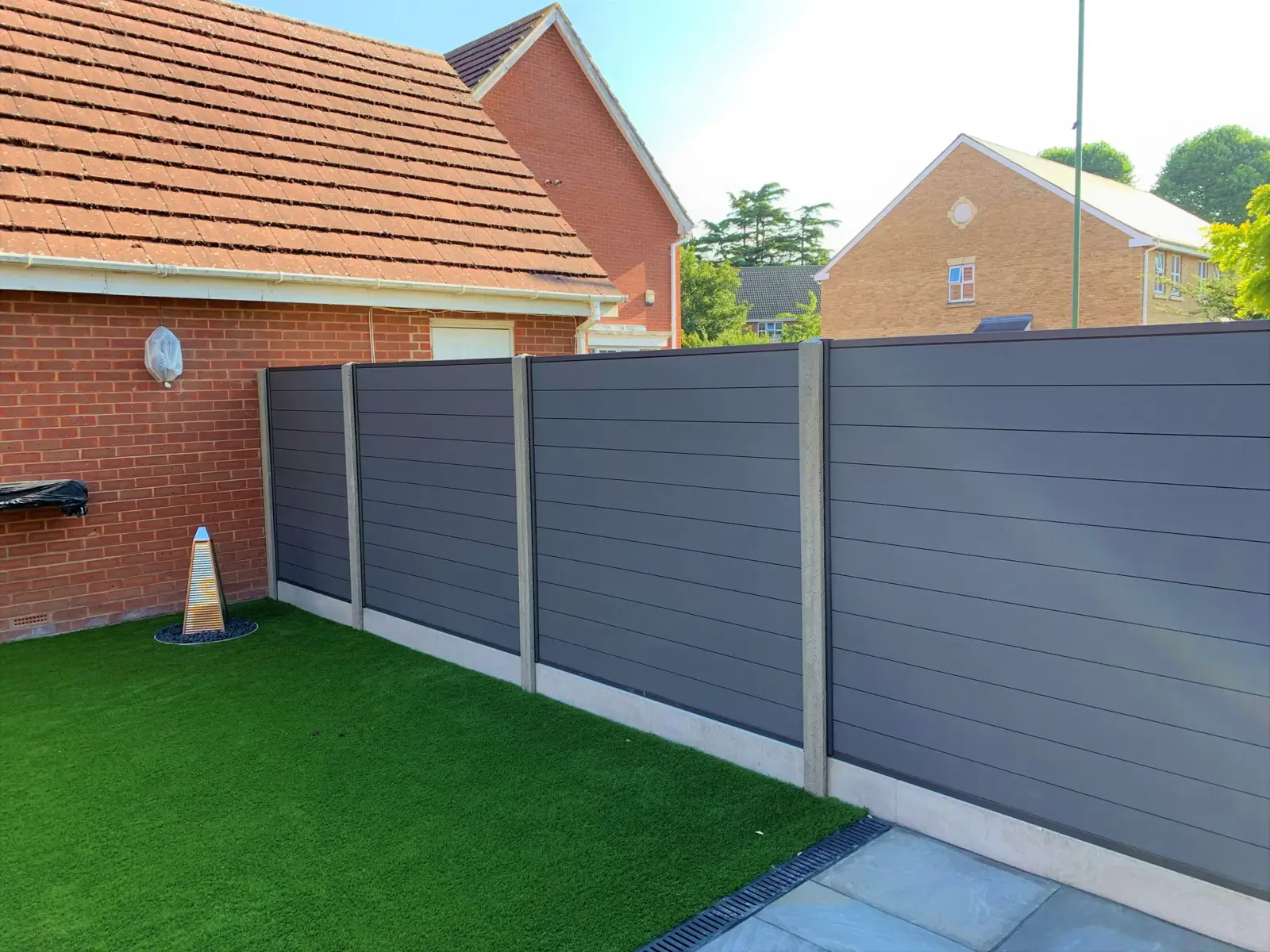 Composite fence panels with timber-effect grain