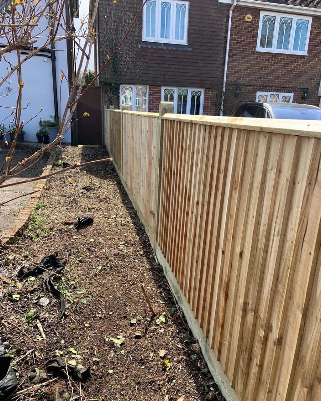 Wooden fence line in a garden
