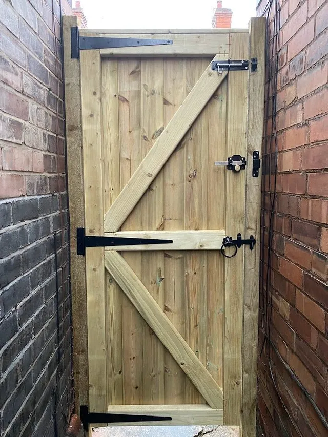 Wooden garden gate in a boundary opening