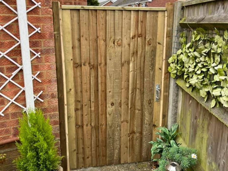 Garden gate with timber frame