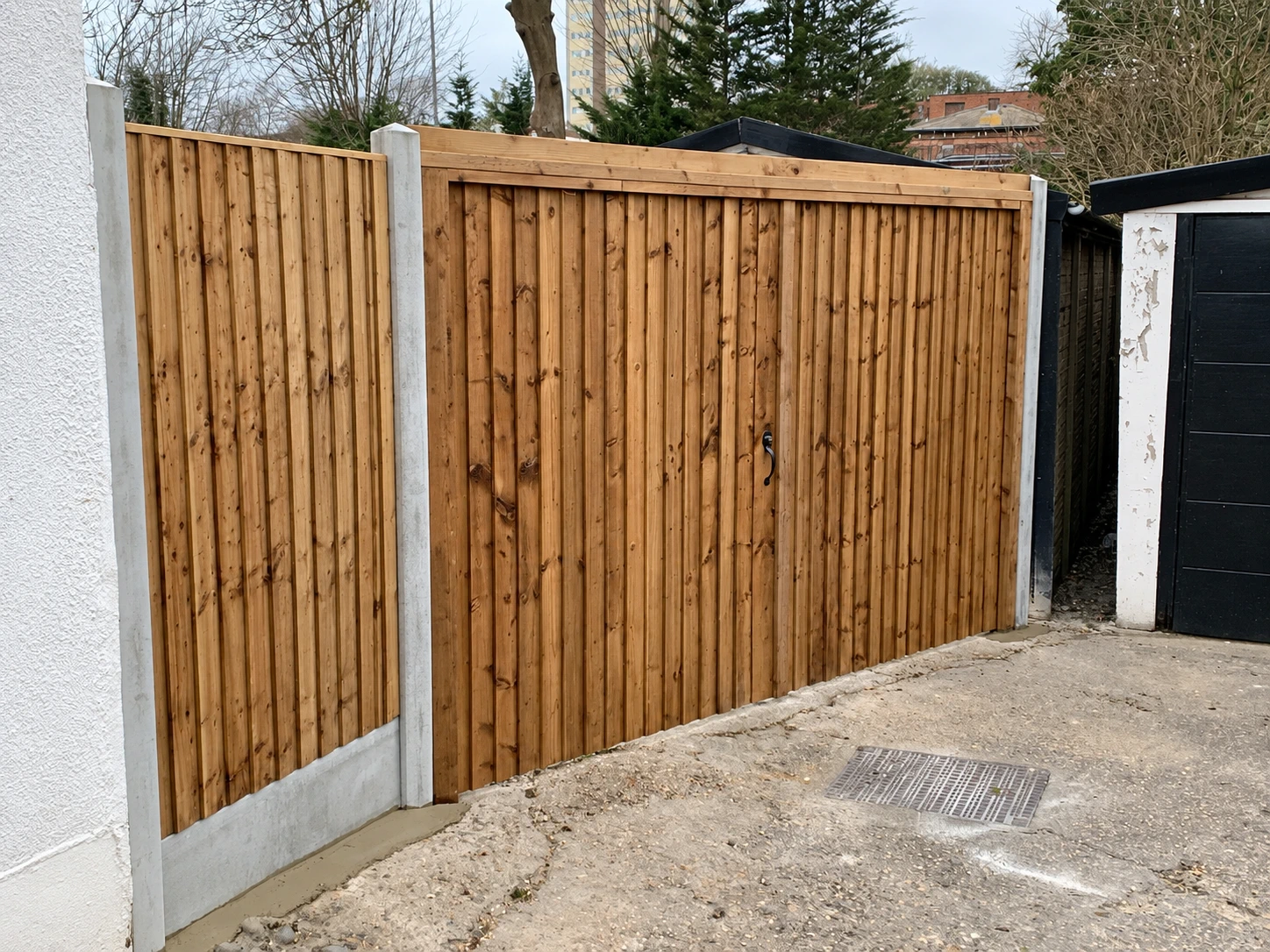Wide timber gate with a coordinated closeboard finish; supplied project image
