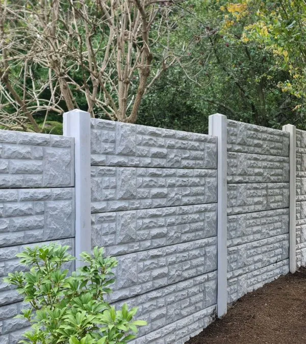 Timber fence with concrete gravel boards