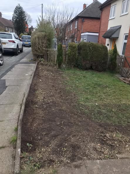 Cheddleton garden strip before hedge removal, with bare soil, paving and a remaining hedge