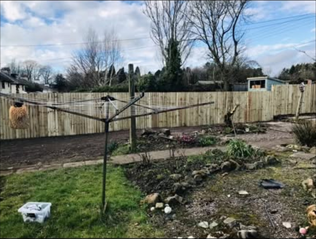 Cheddleton garden after hedge removal, with the new feather-edge and post-and-rail boundary visible