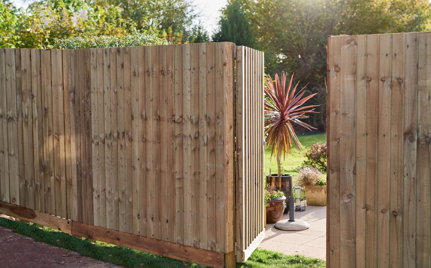Timber boundary fence beside a home
